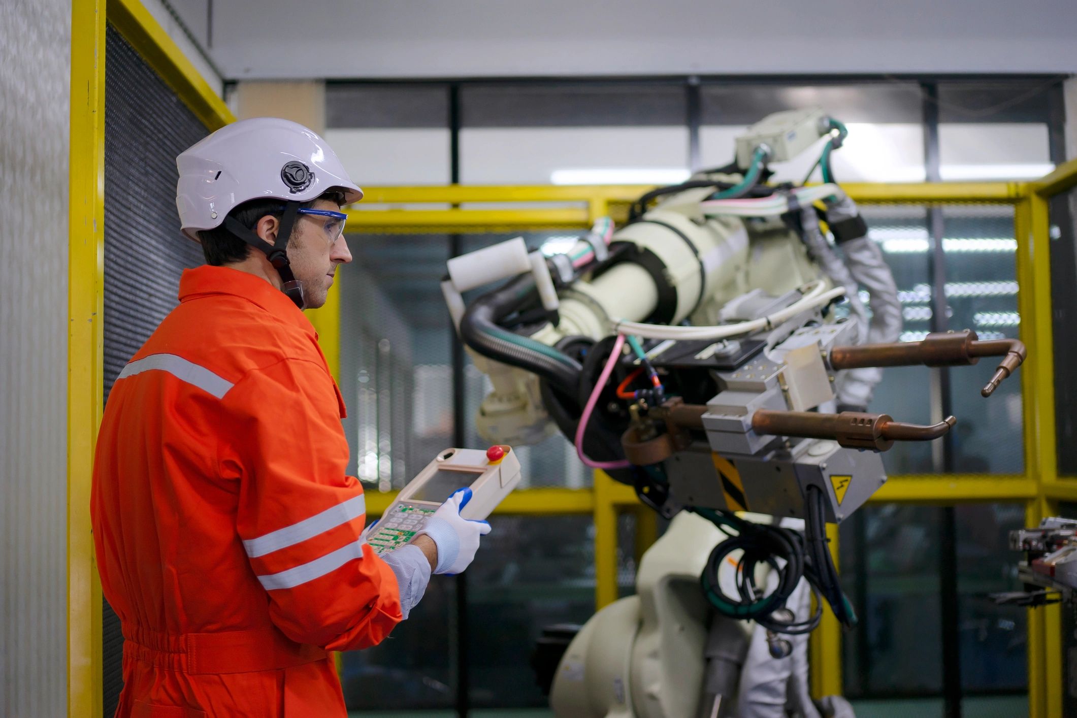 Technician working with robotic automation equipment